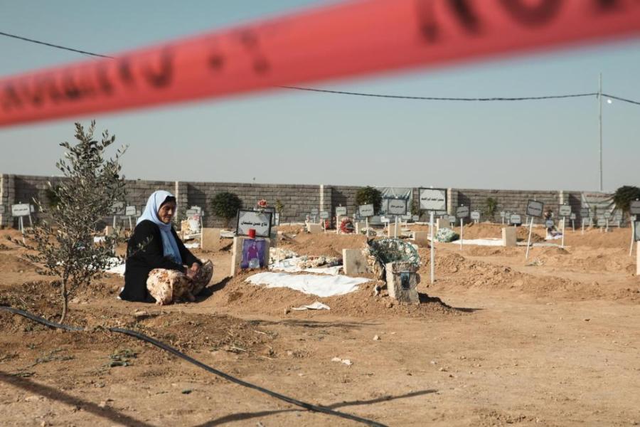 In 2021, dozens of bodies of genocide victims were exhumed from mass graves and returned to family members by IOM for burial rites in old Kocho town, Sinjar, Iraq. Photo © IOM 2021/Raber AZIZ